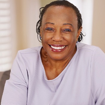 Closeup of senior woman smiling at home