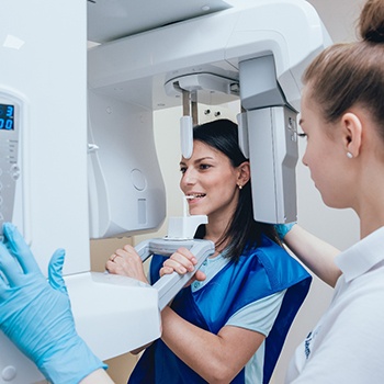 a patient receiving a cone beam CT scan in a dental office