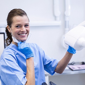 a dental hygienist smiling in a dental office