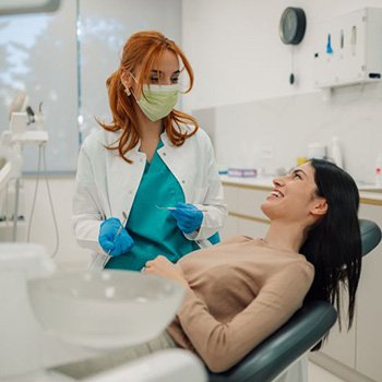 Dentist and patient engaged in conversation