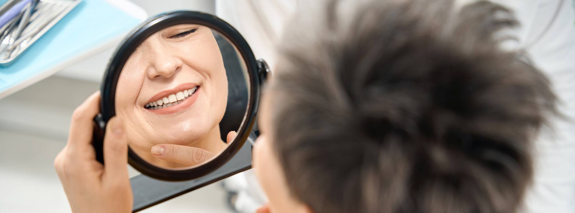 Young woman pleased with his smile makeover in Coppell