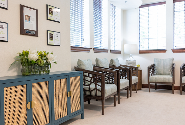Multiple empty chairs in dental waiting room