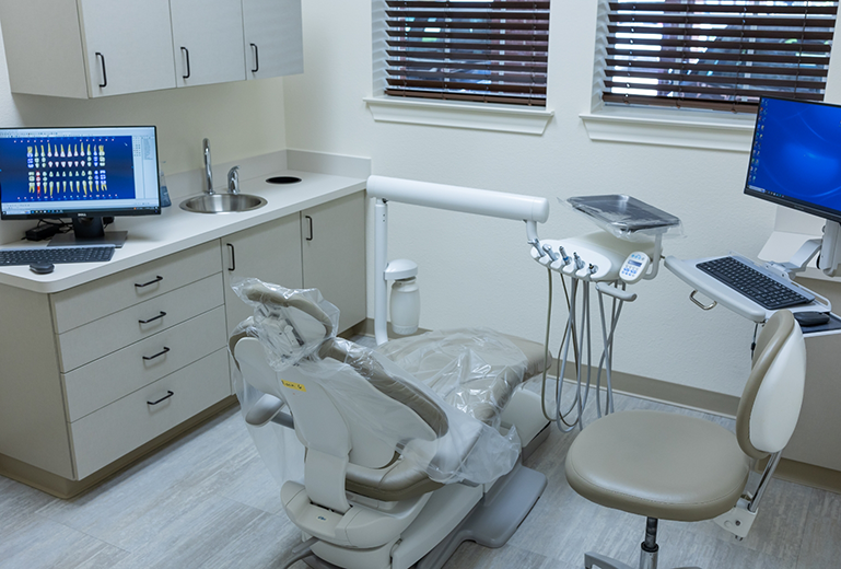 Dental chair in dental treatment room