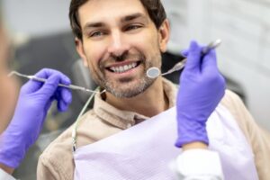 Man smiling after his fluoride treatment