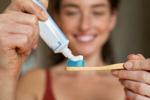 Woman getting ready to brush her teeth